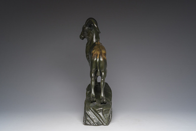 Raymond de Meester de Betzenbroeck (1904-1995): Un mouflon sur un rocher, bronze &agrave; patine verte
