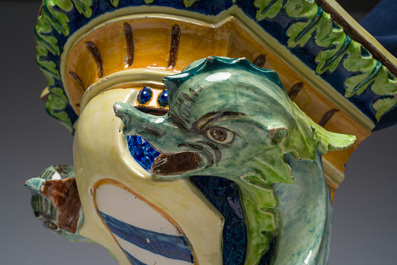 Trois consoles d'appliques en majolique polychrome &agrave; d&eacute;cor d'une sir&egrave;ne, d'un mascaron et d'un blason, une marqu&eacute;e Sarreguemines, France, d&eacute;but 20&egrave;me