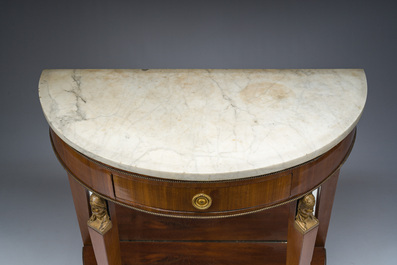 Georges Jacob (1739&ndash;1814): Console Empire demi-lune en acajou et bronze dor&eacute; ouvrant par un tiroir et surmont&eacute;e d'une tablette en marbre blanc