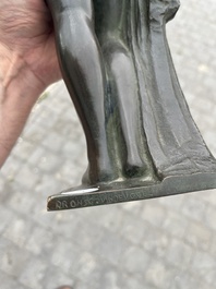 Andr&eacute; Taeckens (1906-1965): Femme nue debout portant un collier, bronze patin&eacute;, marque de fonderie 'Brons G. Vindevogel'