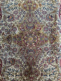 A Persian Kashan 'Mohtashem' silk rug with floral design, early 20th C.