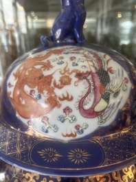 A pair of large Chinese famille rose blue-ground 'dragons and phoenixes' vases with covers, Kangxi mark, 19th C.