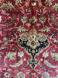 A Persian Isfahan silk rug with floral design, 20th C.