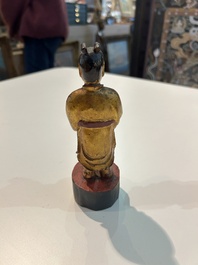 Eight Chinese gilt and polychromed wooden sculptures, 19th/20th C.