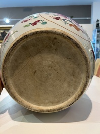 A Chinese famille rose jardini&egrave;re with floral design on a wooden base, 19th C.