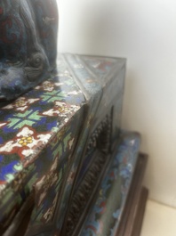 A pair of Chinese cloisonn&eacute; Buddhist lions on a wooden base, 20th C.