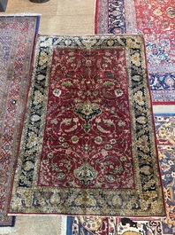 A Persian Isfahan silk rug with floral design, 20th C.