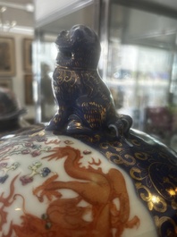 A pair of large Chinese famille rose blue-ground 'dragons and phoenixes' vases with covers, Kangxi mark, 19th C.