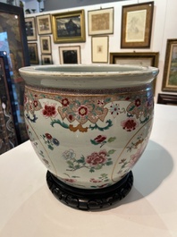 A Chinese famille rose jardini&egrave;re with floral design on a wooden base, 19th C.