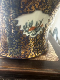 A pair of large Chinese famille rose blue-ground 'dragons and phoenixes' vases with covers, Kangxi mark, 19th C.