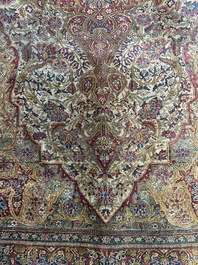 A Persian Kashan 'Mohtashem' silk rug with floral design, early 20th C.