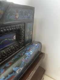 A pair of Chinese cloisonn&eacute; Buddhist lions on a wooden base, 20th C.