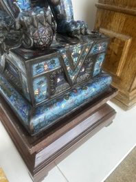 A pair of Chinese cloisonn&eacute; Buddhist lions on a wooden base, 20th C.