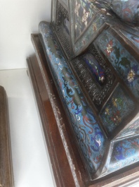 A pair of Chinese cloisonn&eacute; Buddhist lions on a wooden base, 20th C.