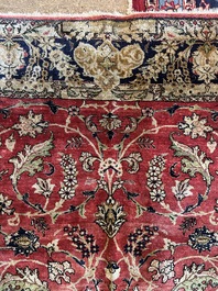 A Persian Isfahan silk rug with floral design, 20th C.