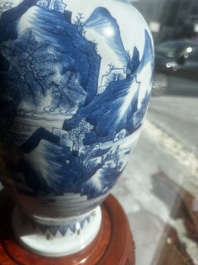 A Chinese blue and white vase with figures in a landscape, Kangxi
