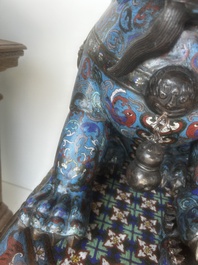 A pair of Chinese cloisonn&eacute; Buddhist lions on a wooden base, 20th C.