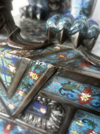 A pair of Chinese cloisonn&eacute; Buddhist lions on a wooden base, 20th C.