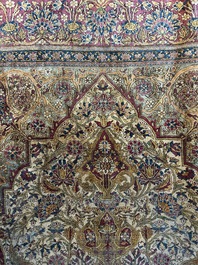 A Persian Kashan 'Mohtashem' silk rug with floral design, early 20th C.