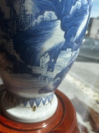 A Chinese blue and white vase with figures in a landscape, Kangxi