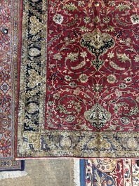 A Persian Isfahan silk rug with floral design, 20th C.