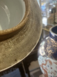 A pair of large Chinese famille rose blue-ground 'dragons and phoenixes' vases with covers, Kangxi mark, 19th C.