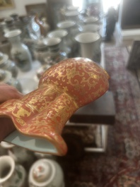 A Chinese ewer-shaped coral-red ground wall pocket vase with gilt lotus scrolls, Qianlong mark, 20th C.