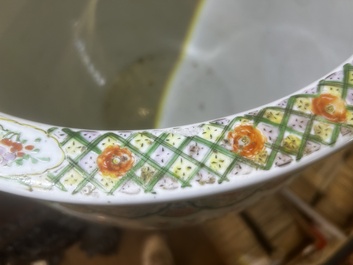 A Chinese famille rose jardini&egrave;re with birds on blossoming branches on an openworked carved wooden stand with marble top, 19th/20th C.