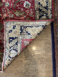 A Persian Isfahan silk rug with floral design, 20th C.