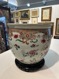 A Chinese famille rose jardini&egrave;re with floral design on a wooden base, 19th C.