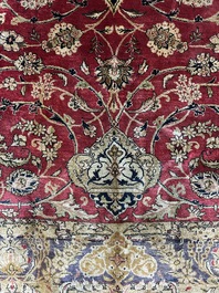 A Persian Isfahan silk rug with floral design, 20th C.