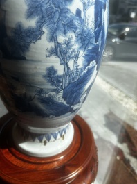 A Chinese blue and white vase with figures in a landscape, Kangxi