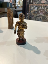 Eight Chinese gilt and polychromed wooden sculptures, 19th/20th C.