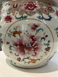 A Chinese famille rose jardini&egrave;re with floral design on a wooden base, 19th C.