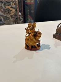 Eight Chinese gilt and polychromed wooden sculptures, 19th/20th C.