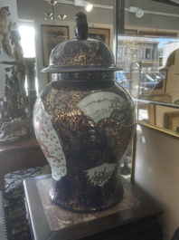 A pair of large Chinese famille rose blue-ground 'dragons and phoenixes' vases with covers, Kangxi mark, 19th C.