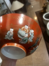A Chinese coral-red ground famille verte bowl with playing boys, 19th/20th C.