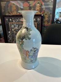 A Chinese famille rose baluster vase with figural design, six-character mark, 20th C.