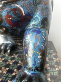 A pair of Chinese cloisonn&eacute; Buddhist lions on a wooden base, 20th C.
