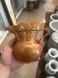 A Chinese ewer-shaped coral-red ground wall pocket vase with gilt lotus scrolls, Qianlong mark, 20th C.