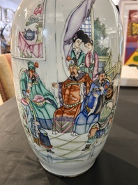 A pair of Chinese famille rose 'animated palace scene' vases, 19th/20th C.