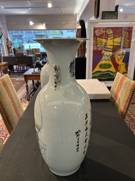 A pair of Chinese famille rose 'animated palace scene' vases, 19th/20th C.