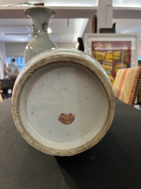 A pair of Chinese famille rose 'animated palace scene' vases, 19th/20th C.