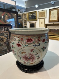 A Chinese famille rose jardini&egrave;re with floral design on a wooden base, 19th C.