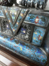 A pair of Chinese cloisonn&eacute; Buddhist lions on a wooden base, 20th C.