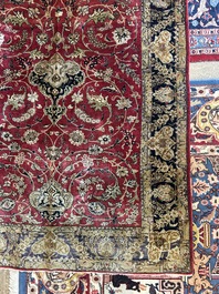 A Persian Isfahan silk rug with floral design, 20th C.