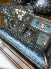 A pair of Chinese cloisonn&eacute; Buddhist lions on a wooden base, 20th C.