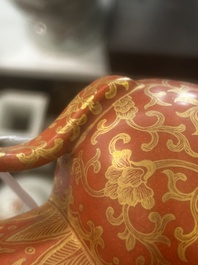 A Chinese ewer-shaped coral-red ground wall pocket vase with gilt lotus scrolls, Qianlong mark, 20th C.
