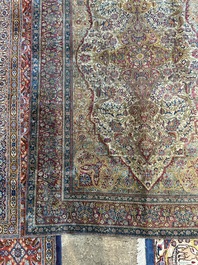 A Persian Kashan 'Mohtashem' silk rug with floral design, early 20th C.