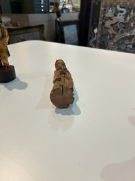 Eight Chinese gilt and polychromed wooden sculptures, 19th/20th C.